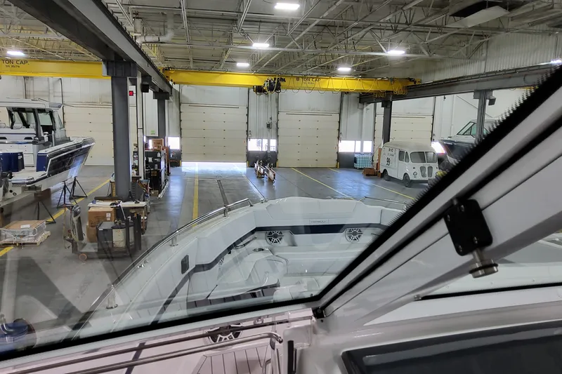 Slide: The Image of Interior view of a boat manufacturing facility with a 2026 Formula 380 Super Sport Crossover OB. - 41