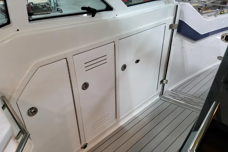 Slide: The Image of 2026 Formula 380 Super Sport Crossover OB interior with sleek white cabinetry and modern design. - 43