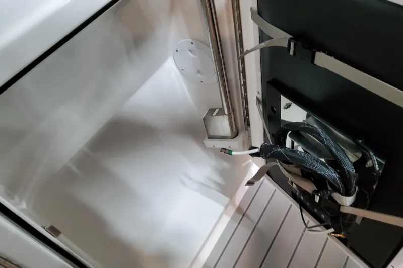 Slide: The Image of Storage compartment in a 2026 Formula 380 Super Sport Crossover OB boat. - 44