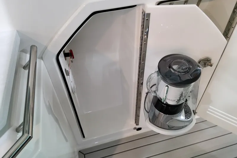 Slide: The Image of 2026 Formula 380 Super Sport Crossover OB interior with built-in blender storage. - 45