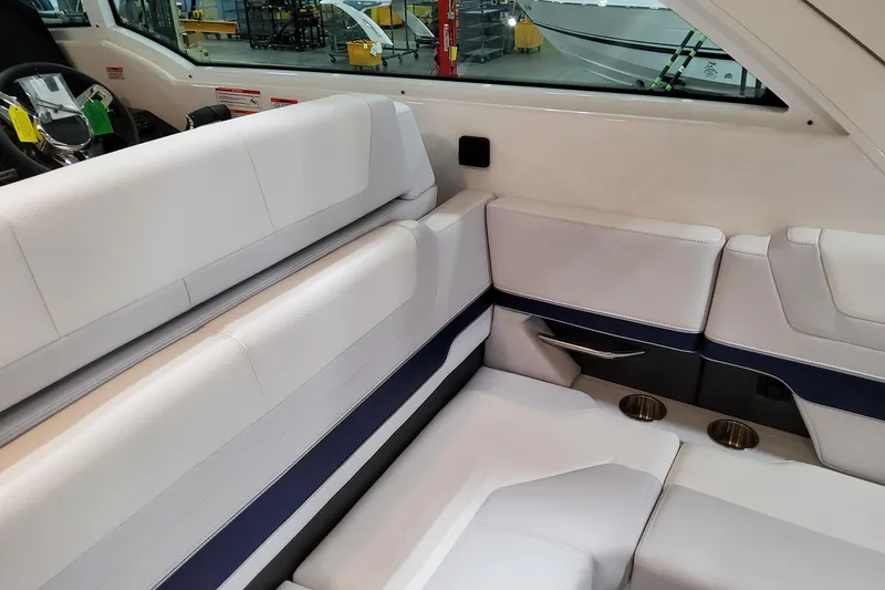 Slide: The Image of 2026 Formula 380 Super Sport Crossover OB interior with white seating and cup holders. - 59