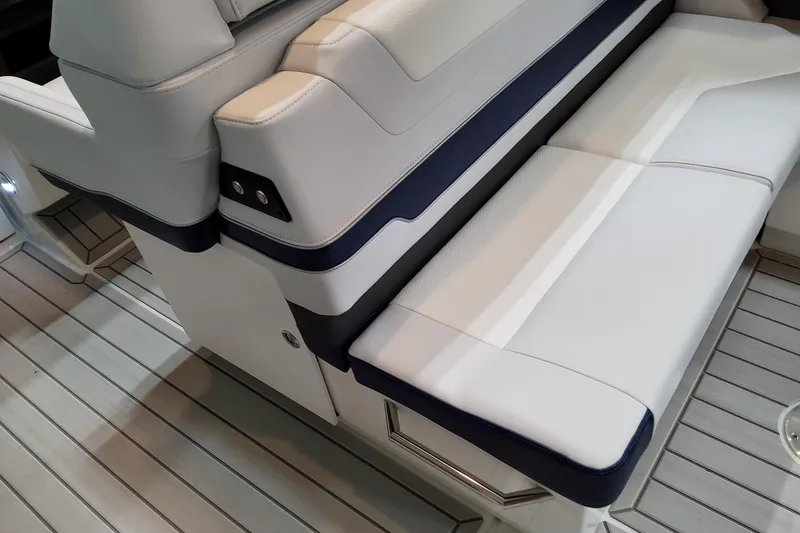 Slide: The Image of 2026 Formula 380 Super Sport Crossover OB boat seating, featuring sleek white and navy upholstery. - 60