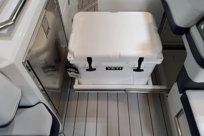 Slide: The Image of YETI cooler on Formula 380 Super Sport Crossover OB, 2026 model, sleek boat interior. - 61