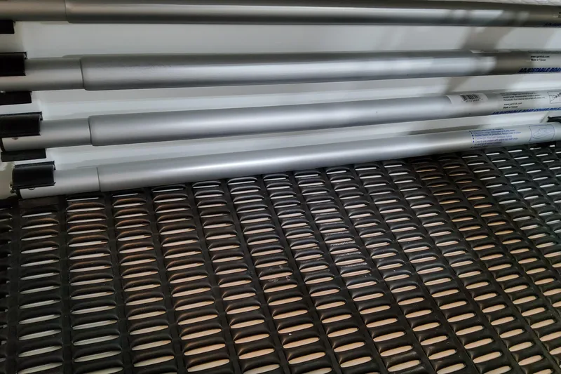 Slide: The Image of Silver poles on a textured metal surface, related to Formula 380 Super Sport Crossover OB 2026. - 62