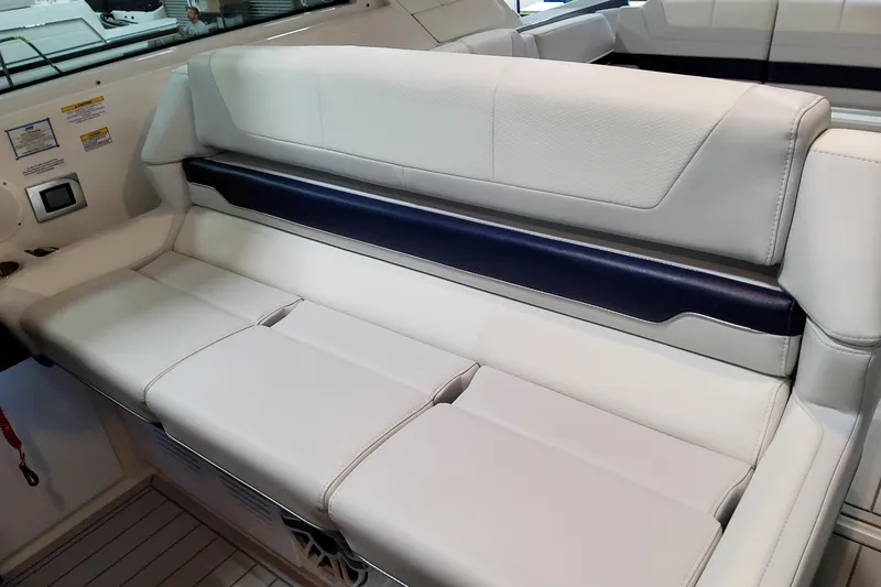 Slide: The Image of 2026 Formula 380 Super Sport Crossover OB interior seating, featuring luxurious white and navy upholstery. - 67