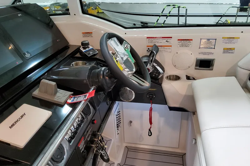 Slide: The Image of 2026 Formula 380 Super Sport Crossover OB cockpit with modern controls and steering wheel. - 70