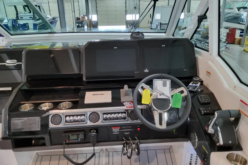 Slide: The Image of 2026 Formula 380 Super Sport Crossover OB helm with advanced controls and navigation displays. - 74