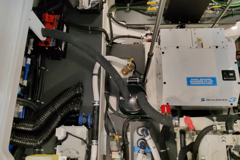 Slide: The Image of Engine room of 2026 Formula 380 Super Sport Crossover OB with Seakeeper 3 stabilizer. - 76