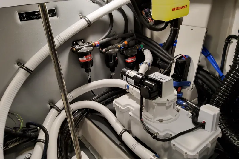 Slide: The Image of Engine room of 2026 Formula 380 Super Sport Crossover OB with complex wiring and components. - 78