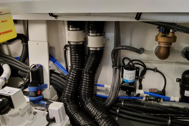 Slide: The Image of Engine room of 2026 Formula 380 Super Sport Crossover OB with hoses and equipment. - 79