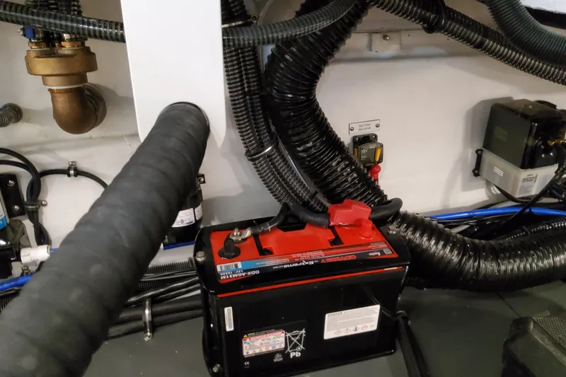 Slide: The Image of Engine compartment of 2026 Formula 380 Super Sport Crossover OB with battery and wiring. - 80