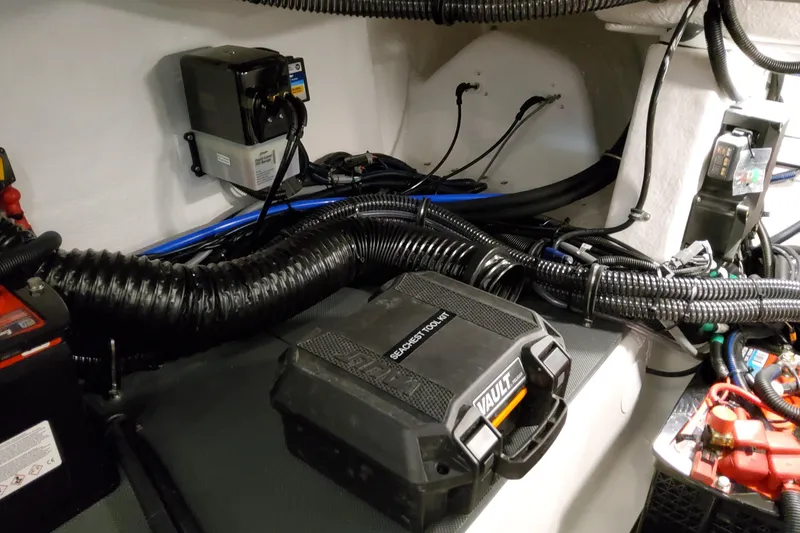 Slide: The Image of Engine compartment of 2026 Formula 380 Super Sport Crossover OB with wiring and tool kit. - 81