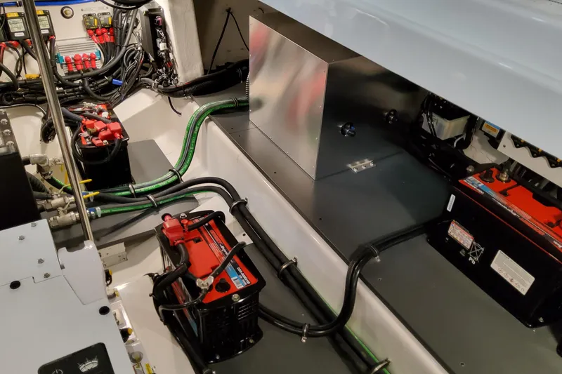 Slide: The Image of Engine compartment of 2026 Formula 380 Super Sport Crossover OB with batteries and wiring. - 89