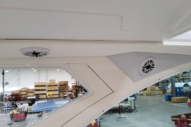 Slide: The Image of 2026 Formula 380 Super Sport Crossover OB interior with speakers in a manufacturing setting. - 96