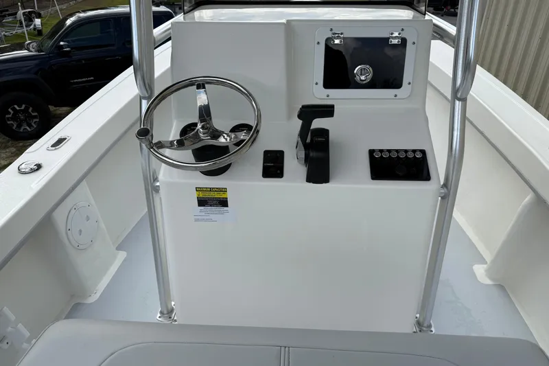 Slide: The Image of 2024 May-Craft 20 Cape Classic boat console with steering wheel and controls. - 6