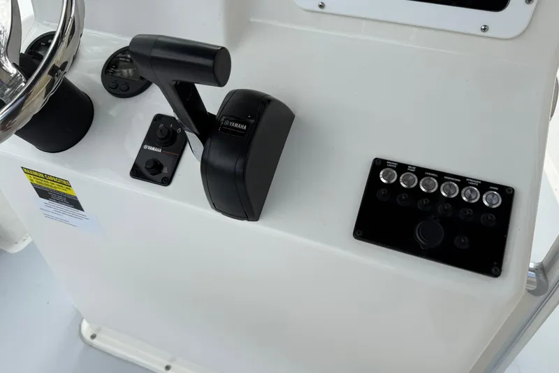 Slide: The Image of 2024 May-Craft 20 Cape Classic boat console with Yamaha controls and switches. - 8