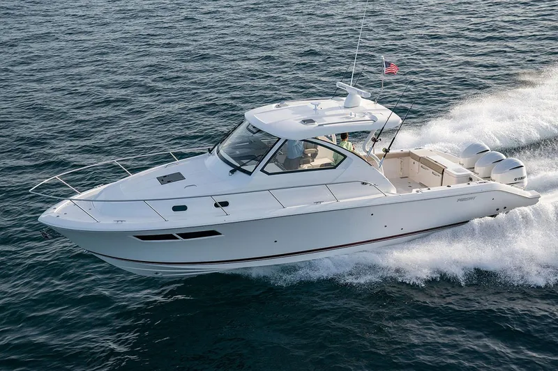 Slide: The Image of Manufacturer Provided Image: 2025 Pursuit OS 355 Offshore boat cruising on open water. - 2
