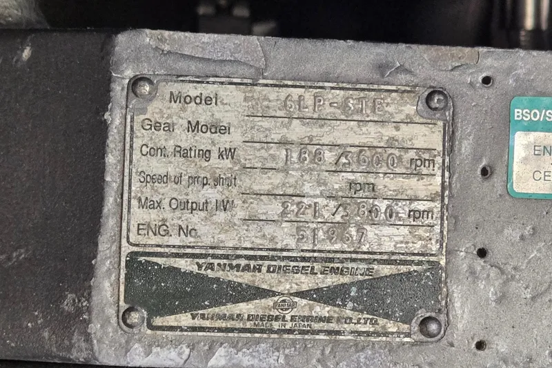 Slide: The Image of Close-up of a Yanmar diesel engine plate on a 2000 Mainship 390 Trawler. - 25