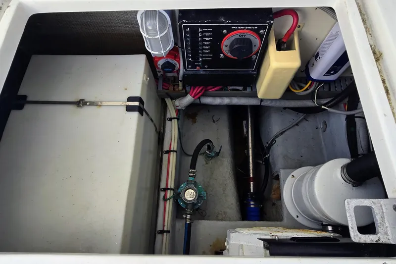 Slide: The Image of Engine compartment of 2000 Mainship 390 Trawler with battery switch and wiring. - 26