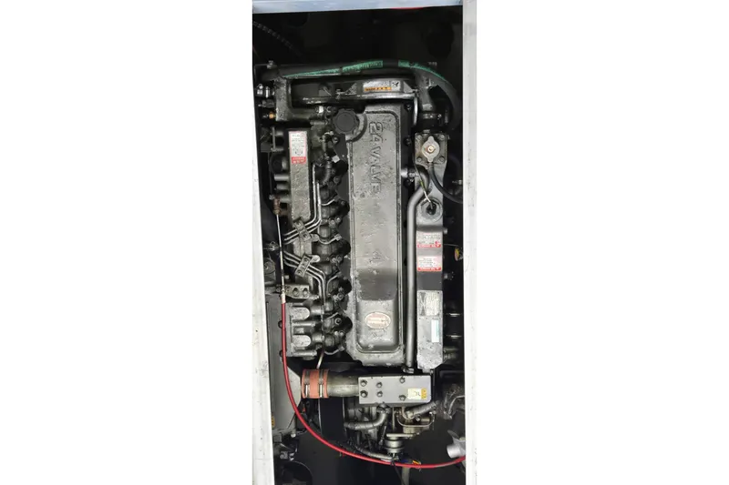 Slide: The Image of Engine of 2000 Mainship 390 Trawler, detailed view of mechanical components. - 27