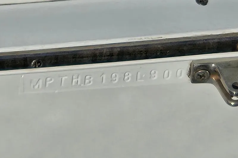 Slide: The Image of Hull identification number on 2000 Mainship 390 Trawler boat. - 28