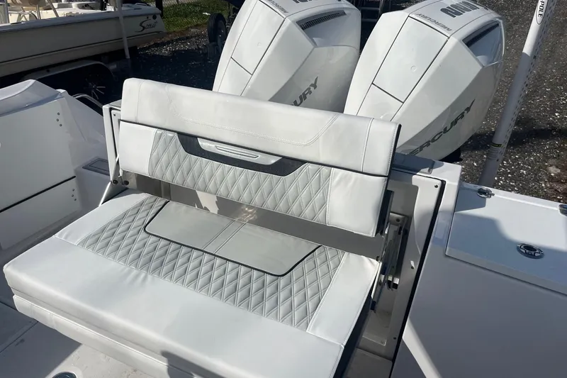 Slide: The Image of 2025 Blackfin 252 CC boat with dual Mercury engines and luxurious seating. - 4