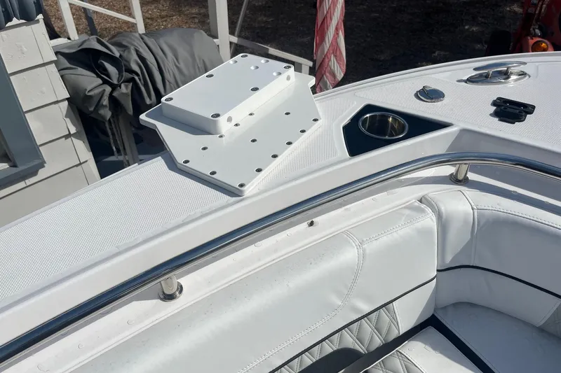 Slide: The Image of 2025 Blackfin 252 CC boat interior with white seating and stainless steel railings. - 8