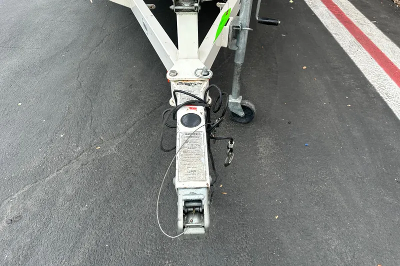 Slide: The Image of 2002 Chaparral 183 SS boat interior with steering wheel, gauges, and white seating. - 9