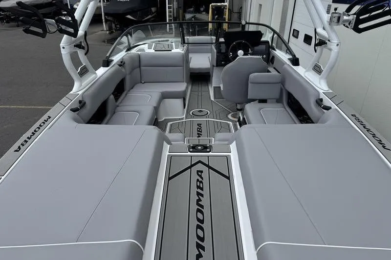 Slide: The Image of 2025 Moomba Craz boat interior with sleek gray seating and modern design. - 5
