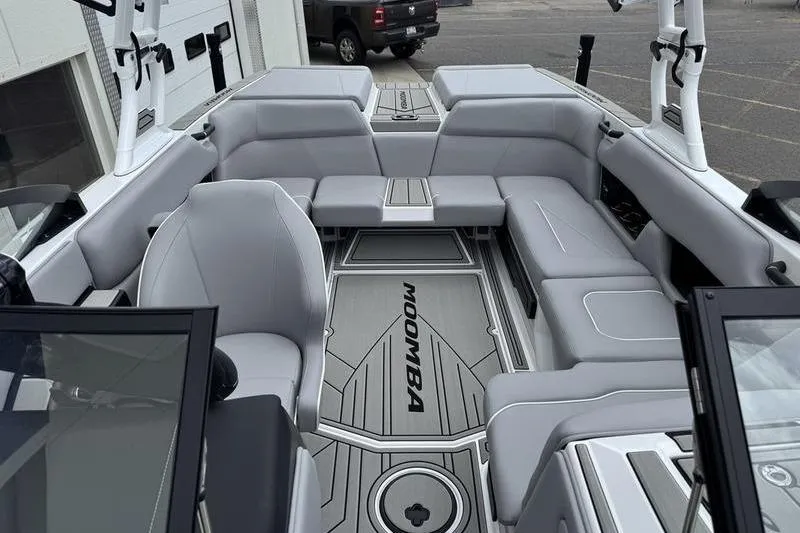 Slide: The Image of 2025 Moomba Craz boat interior with gray seating and modern design. - 7