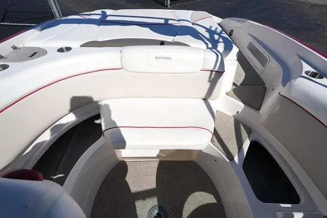 Slide: The Image of 2007 Rinker 226 Captiva Bowrider interior with white seating and red accents. - 13