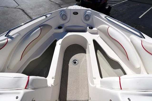 Slide: The Image of 2007 Rinker 226 Captiva Bowrider interior with white seating and red accents. - 7