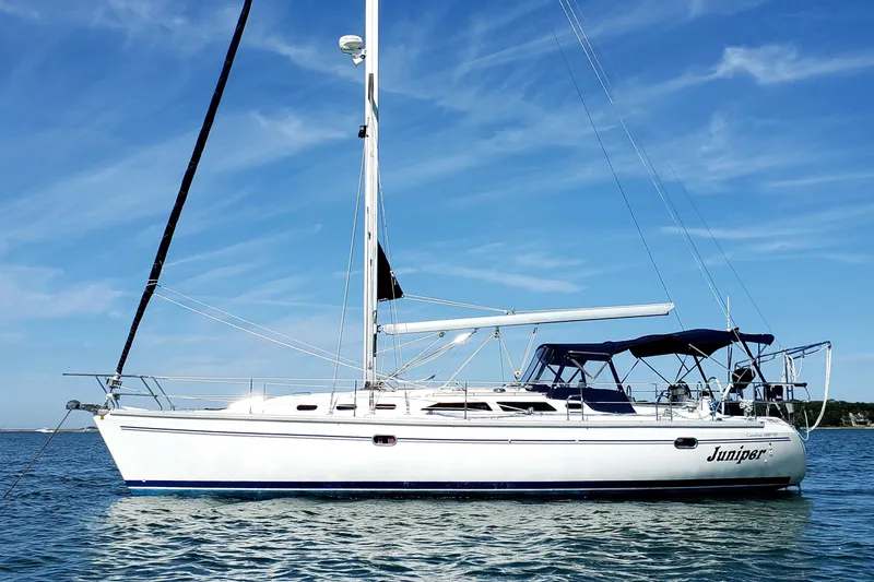 The Image of 2006 Catalina 400 MkII sailboat on calm water under a clear blue sky. - 0