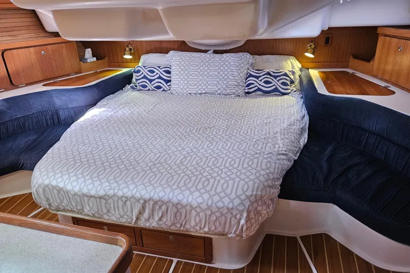 Slide: The Image of Cozy cabin interior of 2006 Catalina 400 MkII sailboat with comfortable bedding. - 11