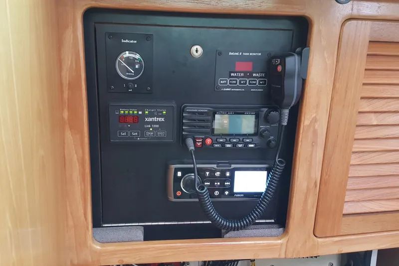 Slide: The Image of Control panel of a 2006 Catalina 400 MkII sailboat with communication and monitoring equipment. - 14