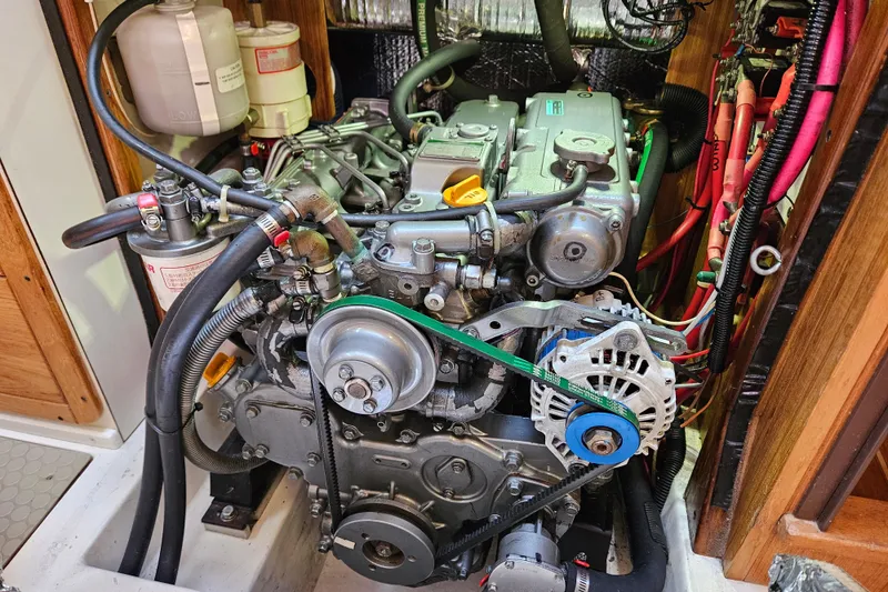 Slide: The Image of Engine compartment of a 2006 Catalina 400 MkII sailboat, showing detailed mechanical components. - 17