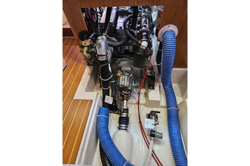 Slide: The Image of Engine compartment of a 2006 Catalina 400 MkII sailboat, showing detailed mechanical components. - 20