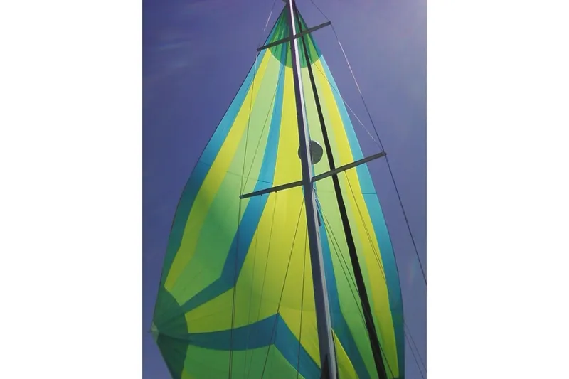 Slide: The Image of Colorful sail of 2006 Catalina 400 MkII against clear blue sky. - 22