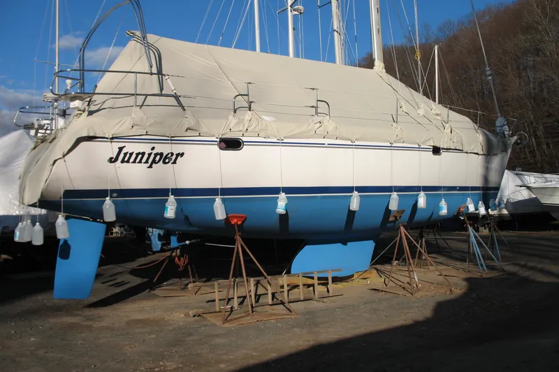 Slide: The Image of Catalina 400 MkII sailboat, 2006 model, covered and supported on stands in a boatyard. - 23