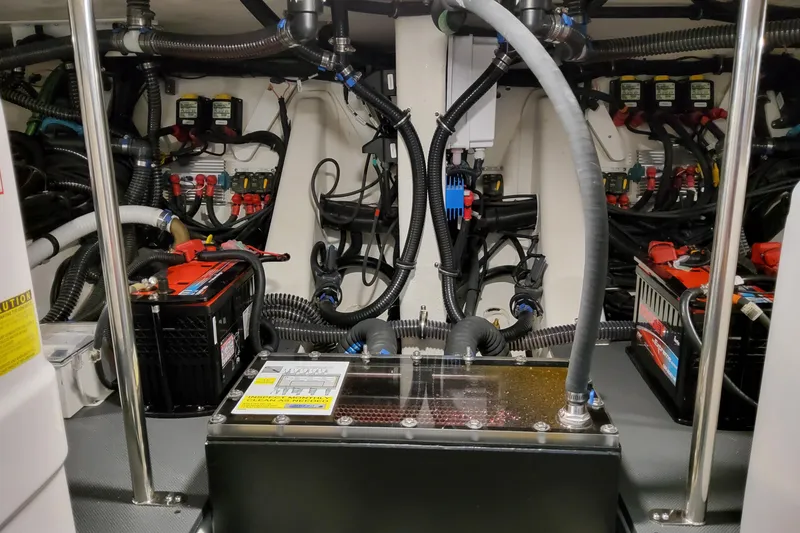 Slide: The Image of Engine compartment of 2026 Formula 457 Center Console Fish, showcasing wiring and battery systems. - 11