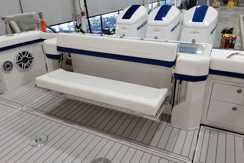 Slide: The Image of 2026 Formula 457 Center Console Fish boat interior with seating and Mercury engines. - 17