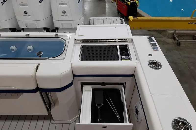 Slide: The Image of 2026 Formula 457 Center Console Fish boat with grill and storage compartments. - 19