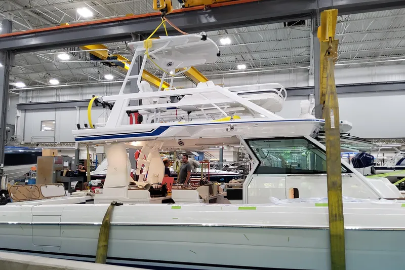 Slide: The Image of 2026 Formula 457 Center Console Fish boat in a manufacturing facility. - 2