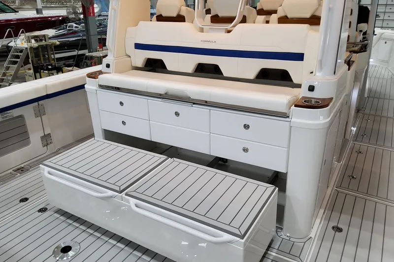 Slide: The Image of 2026 Formula 457 Center Console Fish boat interior with seating and storage compartments. - 21