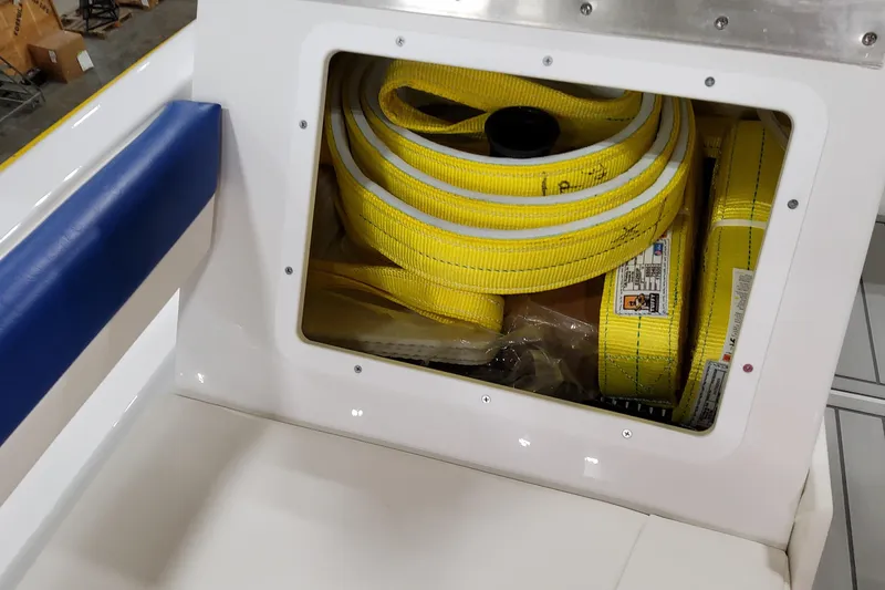 Slide: The Image of Storage compartment with yellow straps on a 2026 Formula 457 Center Console Fish boat. - 29