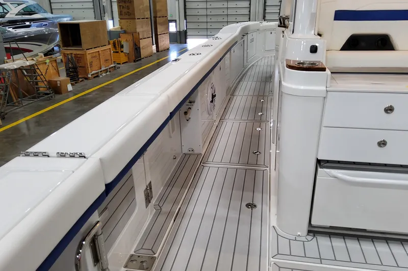 Slide: The Image of 2026 Formula 457 Center Console Fish boat interior with sleek white deck and storage compartments. - 30