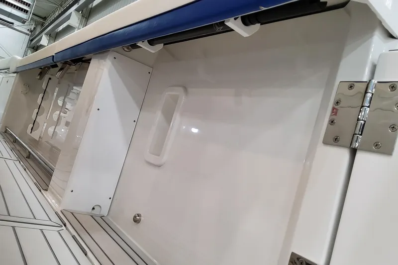 Slide: The Image of 2026 Formula 457 Center Console Fish boat interior with sleek design and stainless steel hinge. - 33