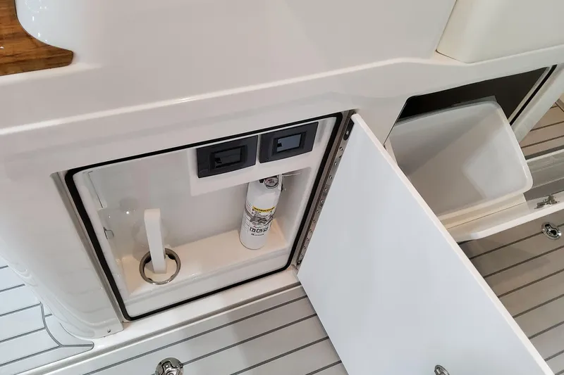 Slide: The Image of 2026 Formula 457 Center Console Fish boat storage compartments and equipment detail. - 35