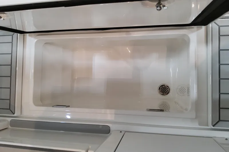 Slide: The Image of Open storage compartment on 2026 Formula 457 Center Console Fish boat. - 36