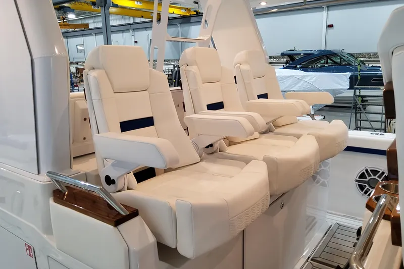 Slide: The Image of Luxurious seating on 2026 Formula 457 Center Console Fish boat in a showroom. - 38